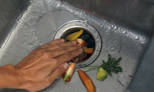 Throwing Food Putting Food In Garbage Disposal